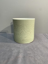 A Chinese incised celadon-glazed 'lotus scroll' brush pot, Kangxi