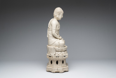 An extremely rare Chinese Swatow cream-glazed seated Buddha, Xuande mark, Ming