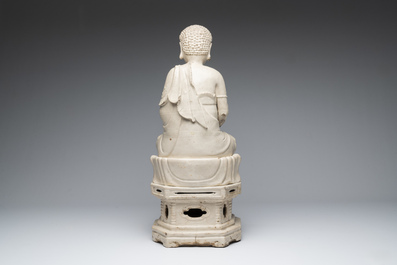An extremely rare Chinese Swatow cream-glazed seated Buddha, Xuande mark, Ming