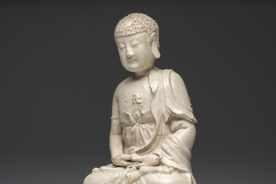 An extremely rare Chinese Swatow cream-glazed seated Buddha, Xuande mark, Ming