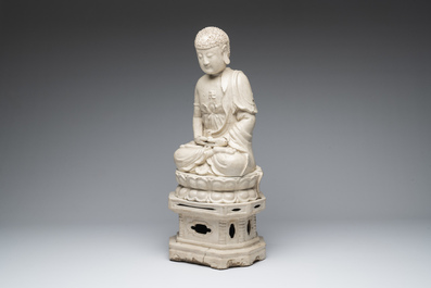 An extremely rare Chinese Swatow cream-glazed seated Buddha, Xuande mark, Ming