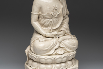 An extremely rare Chinese Swatow cream-glazed seated Buddha, Xuande mark, Ming