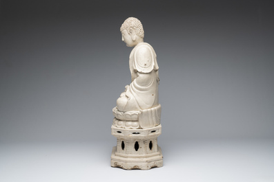An extremely rare Chinese Swatow cream-glazed seated Buddha, Xuande mark, Ming