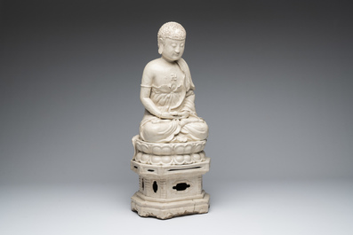 An extremely rare Chinese Swatow cream-glazed seated Buddha, Xuande mark, Ming