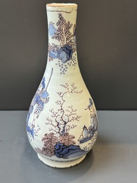 A Dutch Delft blue, white and manganese chinoiserie bottle vase, late 17th C.