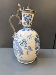 A Dutch Delft blue and white pewter-mounted armorial jug, late 17th C.