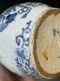 A Dutch Delft blue and white pewter-mounted armorial jug, late 17th C.