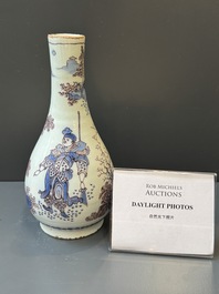 A Dutch Delft blue, white and manganese chinoiserie bottle vase, late 17th C.