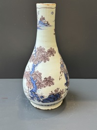 A Dutch Delft blue, white and manganese chinoiserie bottle vase, late 17th C.