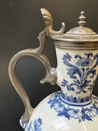 A Dutch Delft blue and white pewter-mounted armorial jug, late 17th C.