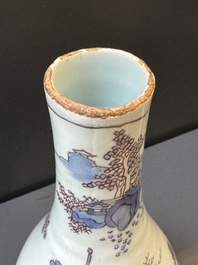 A Dutch Delft blue, white and manganese chinoiserie bottle vase, late 17th C.