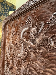 A rectangular Chinese carved red lacquer 'dragon' table screen, later wooden stand, Qianlong