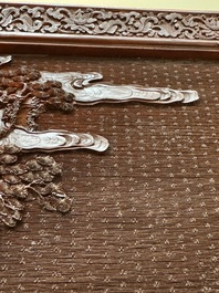 A rectangular Chinese carved red lacquer 'dragon' table screen, later wooden stand, Qianlong