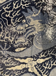 A massive Chinese blue and white reverse-decorated  'dragon' charger with bronze mounts, Chuxiu Gong Zhi mark, Guangxu