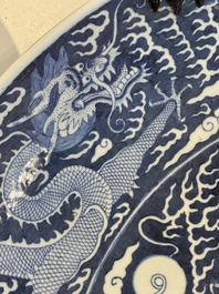 A massive Chinese blue and white reverse-decorated  'dragon' charger with bronze mounts, Chuxiu Gong Zhi mark, Guangxu