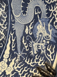 A massive Chinese blue and white reverse-decorated  'dragon' charger with bronze mounts, Chuxiu Gong Zhi mark, Guangxu