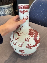 A Chinese copper-red and white 'dragon' bottle vase, 18th C.