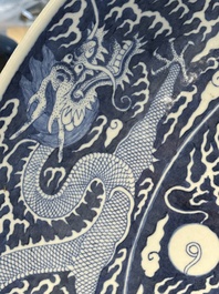 A massive Chinese blue and white reverse-decorated  'dragon' charger with bronze mounts, Chuxiu Gong Zhi mark, Guangxu