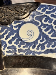 A massive Chinese blue and white reverse-decorated  'dragon' charger with bronze mounts, Chuxiu Gong Zhi mark, Guangxu