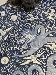 A massive Chinese blue and white reverse-decorated  'dragon' charger with bronze mounts, Chuxiu Gong Zhi mark, Guangxu