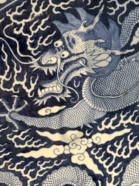 A massive Chinese blue and white reverse-decorated  'dragon' charger with bronze mounts, Chuxiu Gong Zhi mark, Guangxu