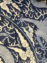 A massive Chinese blue and white reverse-decorated  'dragon' charger with bronze mounts, Chuxiu Gong Zhi mark, Guangxu