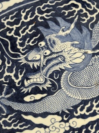 A massive Chinese blue and white reverse-decorated  'dragon' charger with bronze mounts, Chuxiu Gong Zhi mark, Guangxu