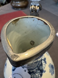 A Dutch Delft blue and white pewter-mounted armorial jug, late 17th C.