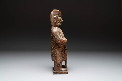 A Chinese Sanxingdui-style marble sculpture of a warrior, 20th C.