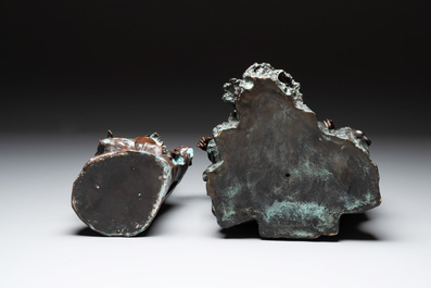 A large Chinese bronze Guanyin seated on rocks and a group of Guanyin with child, 20th C.