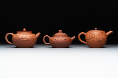 Three Chinese Yixing stoneware teapots and covers, 18th C.