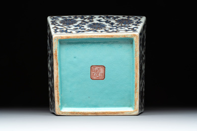 A Chinese gilt-decorated blue and white 'lotus scroll' square bowl, a saucer and a doucai 'dragon' cup, Daoguang mark and of the period