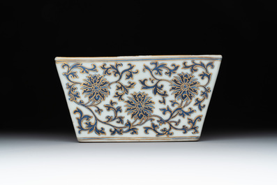 A Chinese gilt-decorated blue and white 'lotus scroll' square bowl, a saucer and a doucai 'dragon' cup, Daoguang mark and of the period