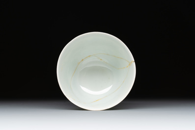 A Chinese gilt-decorated blue and white 'lotus scroll' square bowl, a saucer and a doucai 'dragon' cup, Daoguang mark and of the period
