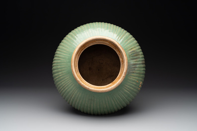 A Chinese Longquan celadon 'lotus' bowl and a large green-glazed jar, Ming and later