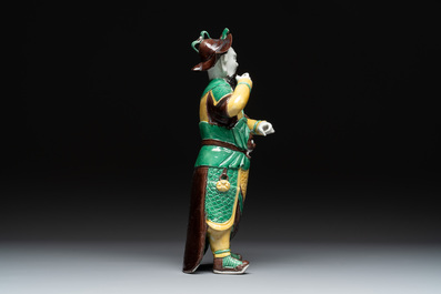 A pair of Chinese sancai-glazed rooftiles, a pair of Buddhist lions and a warrior, Ming and later