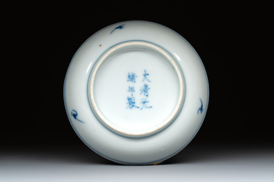 A Chinese gilt-decorated blue and white 'lotus scroll' square bowl, a saucer and a doucai 'dragon' cup, Daoguang mark and of the period