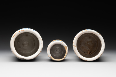 Three rare blue and white Delftware albarelli with painted content medallions and paper shop labels, Northern Europe, 18th C.