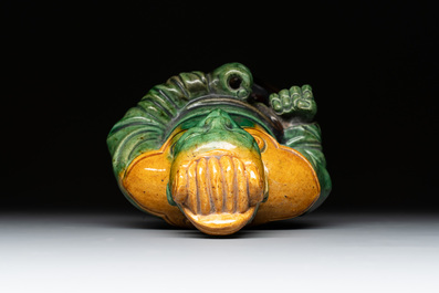A Chinese sancai figure of Garuda, a cream-glazed vase and a pair of wucai jars, 19th C.