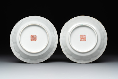 A pair of Chinese famille rose cups and saucers with figural design, Xianfeng mark and of the period