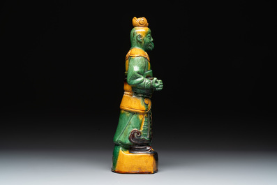 A Chinese sancai figure of Garuda, a cream-glazed vase and a pair of wucai jars, 19th C.
