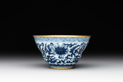 A Chinese gilt-decorated blue and white 'lotus scroll' bowl, Daoguang mark and of the period