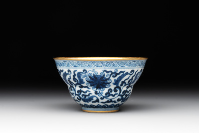 A Chinese gilt-decorated blue and white 'lotus scroll' bowl, Daoguang mark and of the period