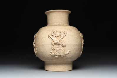 A Chinese sancai figure of Garuda, a cream-glazed vase and a pair of wucai jars, 19th C.