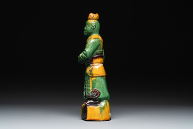 A Chinese sancai figure of Garuda, a cream-glazed vase and a pair of wucai jars, 19th C.