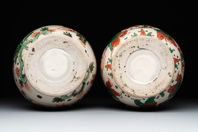 A Chinese sancai figure of Garuda, a cream-glazed vase and a pair of wucai jars, 19th C.