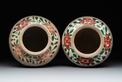 A Chinese sancai figure of Garuda, a cream-glazed vase and a pair of wucai jars, 19th C.