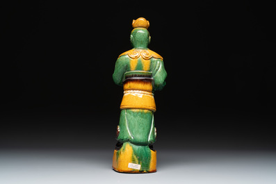 A Chinese sancai figure of Garuda, a cream-glazed vase and a pair of wucai jars, 19th C.