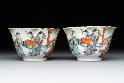 A pair of Chinese famille rose cups and saucers with figural design, Xianfeng mark and of the period