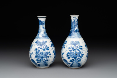 A pair of Chinese blue and white pear-shaped vases with cranes among flowering branches, Kangxi